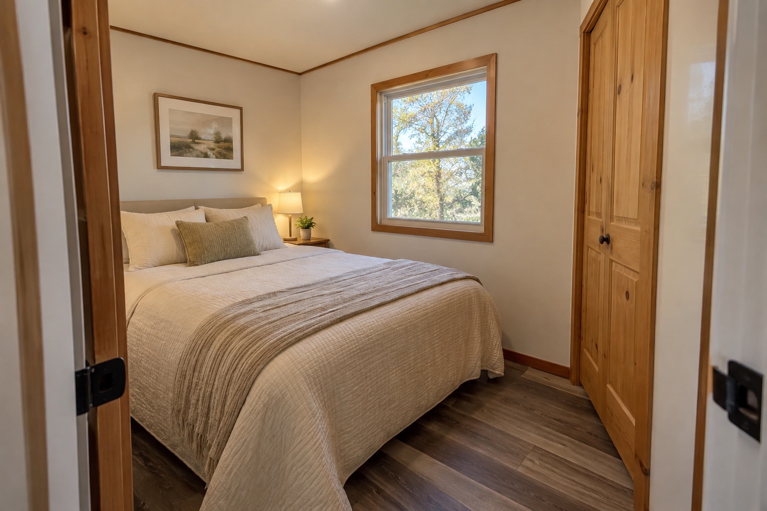 Compact rear bedroom with built-in closet inside the Cedar Run 560